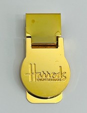 Fermasoldi vintage Harrods in ottone