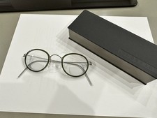 Occhiali Lindberg Lex in titanio verdi e grigi