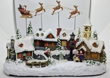 LUMINEO - CHRISTMAS VILLAGE CON RENNE VOLANTI IN MOVIMENTO - CON ALIMENTATORE