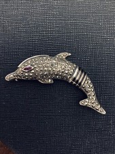 Spilla Anni 70 Delfino in argento con Rubini