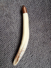 Un Autentico Ciondolo Dente