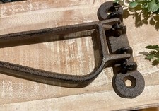 Antico gancio per camino in