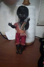 rara vecchia bambolina di colore in plastica dura leggera cm 33,senza marchio