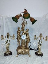 TRITTICO OROLOGIO E CANDELABRI
