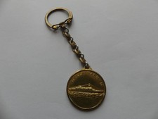 PORTE CLÉ MÉTAL DORE SUN
