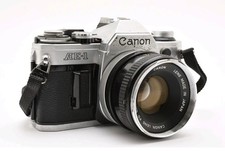 FOTOCAMERA REFLEX CANON AE-1 35mm OBIETTIVO FD 50 1:1,8 JAPAN  TESTATA