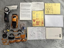 Xmods 2004 Nissan 350z Rame Arancione 1:28 con Kit Luci e Carrozzeria Extra