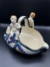 Antica ciotola con manico in