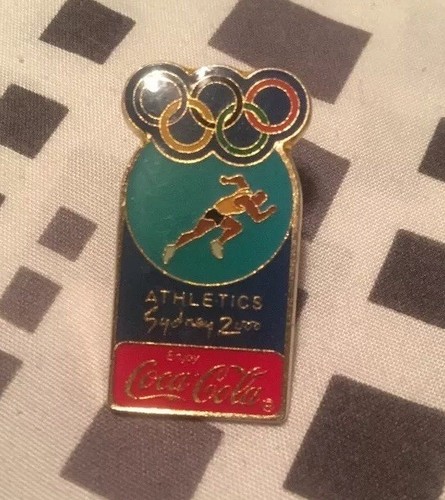 Spilla coca cola - cola, atletica