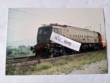 Fotografia Locomotore Elettrico FS E 428 in testa ad un convoglio passeggeri