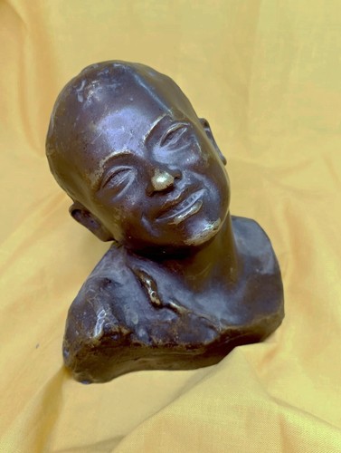 Scultura bronzetto volto - volto, di
