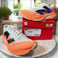 Scarpe da corsa New Balance FuelCell Rebel v4 da donna larghe D Hot Mango WFCXCC4-D N