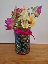 Piccole lattine di fiori