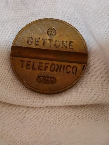 Gettone telefonico 7711 - gettone,