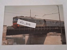 Fotografia Locomotore Diesel FS D 345 in testa ad un convoglio passeggeri