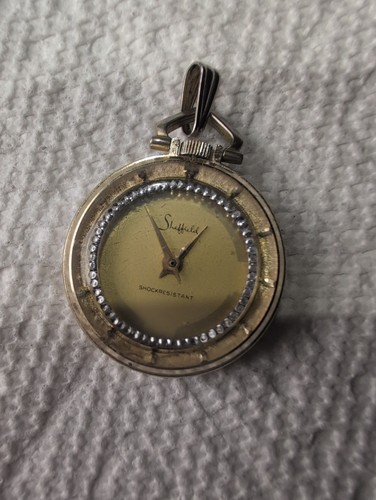 Orologio con ciondolo - a, carica