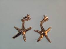 Orecchini colore oro modello stella marina e conchiglia donna