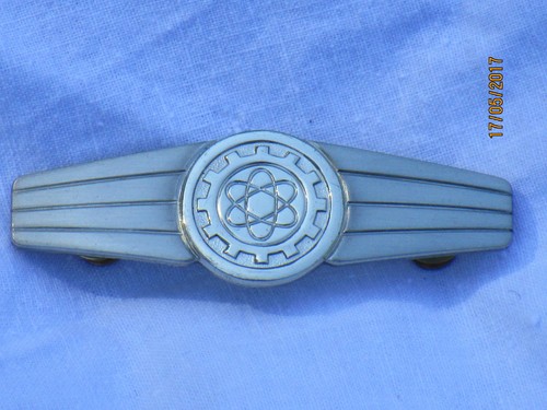 Insignia attività - di,