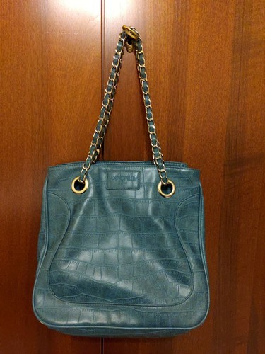 Borsa verde petrolio pitonata