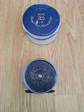 REEL PESCA A MOSCA SALMONE