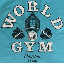 VINTAGE WORLD GYM TSHIRT 80S HOUSTON TEXAS BODYBUILDING LARGE GOLDS TEAL BLUE