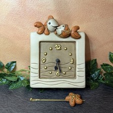 Orologio con coppia di pesci