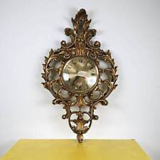 orologio da parete con cornice in legno intagliata