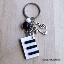 Portachiavi uomo donna pianoforte chiave di violino musica tastiera nota 
