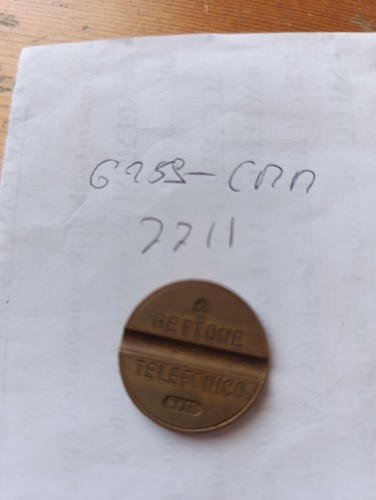 Gettone telefonico 7711 cmm - gettone,