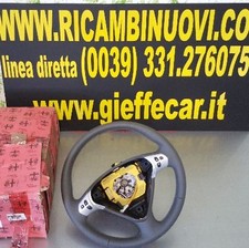 VOLANTE IN PELLE TRAFORATA CON