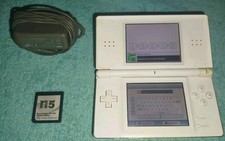 CONSOLE NINTENDO DS LITE  BIANCA R4 CON GIOCHI ,PENNINO E CARICABATTERIA.