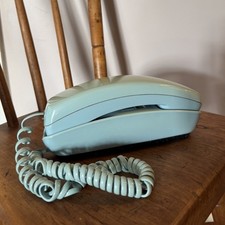 Telefono vintage blu pulsante