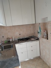 Cucina Scavolini angolare laccato bianco con colonna forno