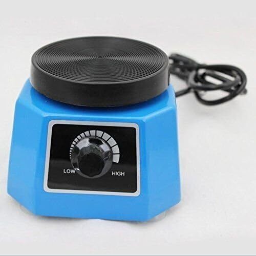 Vibratore per gesso dentale