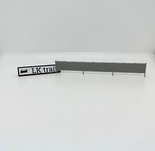 LK TRAIN muro cemento