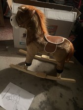cavallo a dondolo in peluche