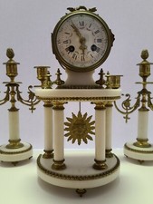 Antico orologio candelabro