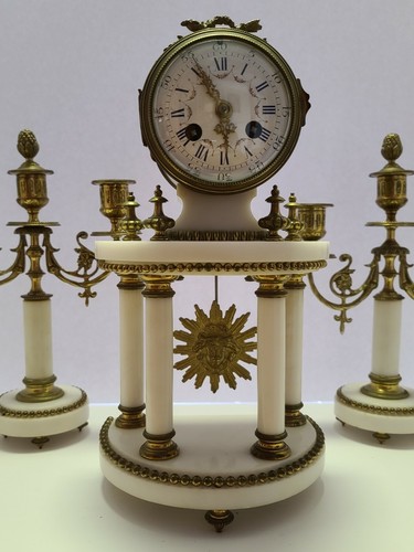 Antico orologio candelabro