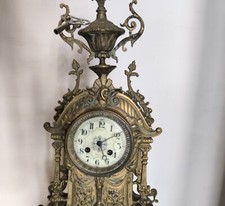 Orologio da camino in bronzo dorato