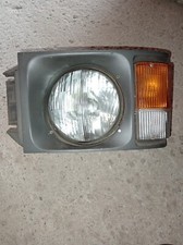 CORNICE GHIERA FARO FIAT OM 40-50-60-70-100 GRIGIO SCURO CON FRECCIA SINISTRO SX