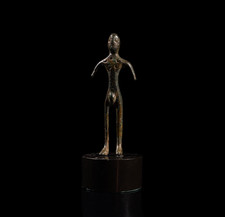 Statua etrusca in bronzo con