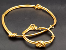 AGATHA PARIS PARURE SET GIROCOLLO E BRACCIALE RIGIDO ORO CON NODO