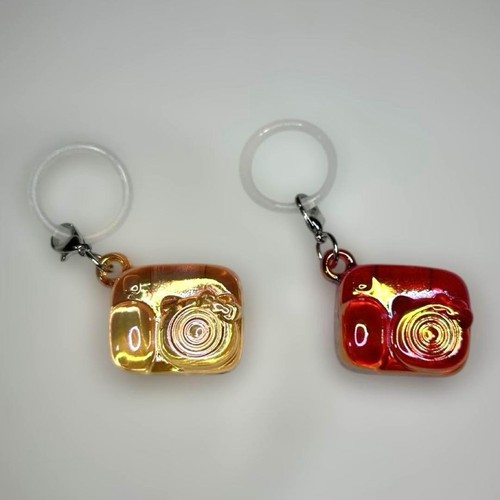 Accessorio ciondolo fotocamera