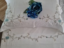 Lenzuola ricamate a punto