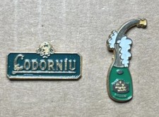 Lotto di 2 spille - logo