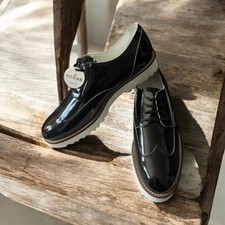 Mocassini Hogan neri cravatte