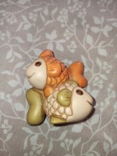 Thun piccoli pesci pesciolini segni zodiacali Zodiaco pesce arancione verde