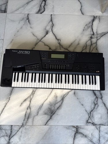 Roland music synthesizer - roland,