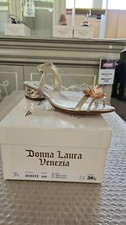 SCARPE IN PELLE DI COLORE ORO