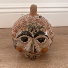 Salvadanaio moneta faccia